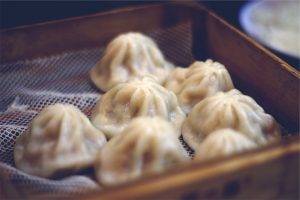 Chinese dumplings in wooden steam basket
